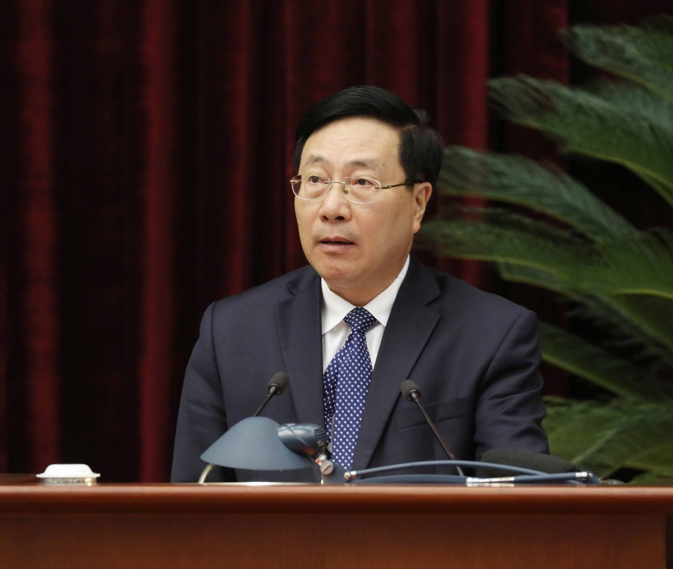 Ông Phạm Bình Minh, Ủy viên Bộ Chính trị, Phó Thủ tướng Thường trực Chính phủ trình bày báo cáo tại hội nghị. (Ảnh: Phương Hoa/TTXVN)