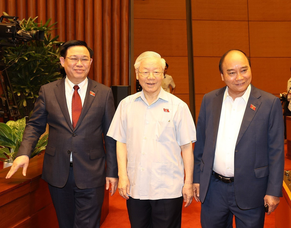 Tổng Bí thư Nguyễn Phú Trọng, Chủ tịch nước Nguyễn Xuân Phúc, Chủ tịch Quốc hội Vương Đình Huệ dự phiên họp. (Ảnh: Trí Dũng/TTXVN)