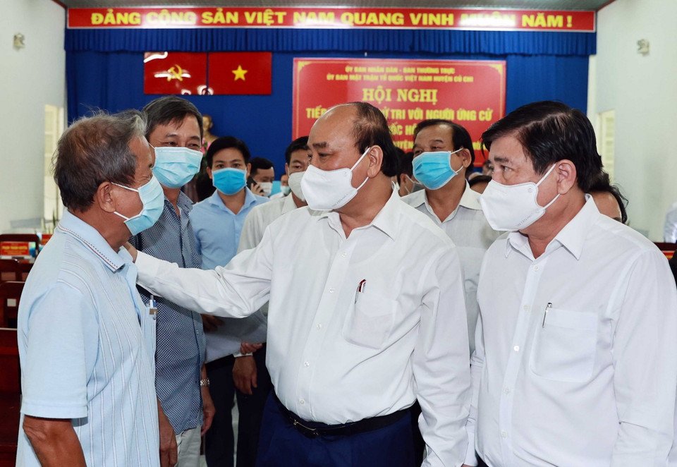 Chủ tịch nước Nguyễn Xuân Phúc tiếp xúc cử tri các xã Tân Thạnh Tây, Tân Thạnh Đông, Hòa Phú, Trung An và Bình Mỹ, huyện Củ Chi ngày 9/5. (Ảnh: Thống Nhất/TTXVN)