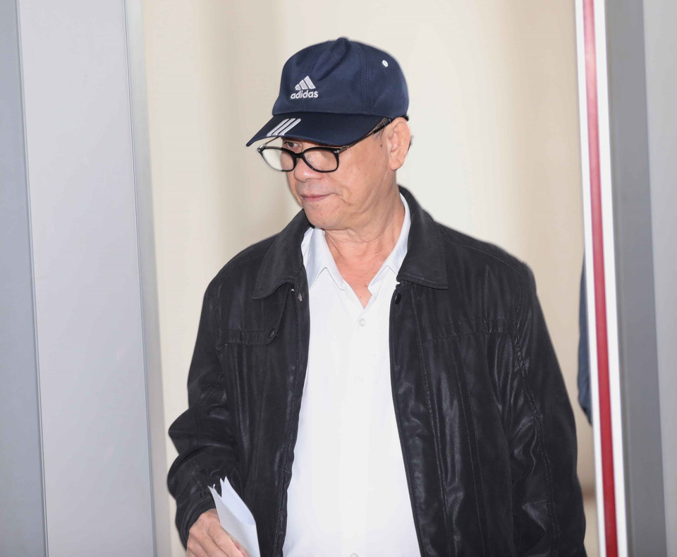 Bị cáo Trần Văn Minh (sinh năm 1955, cựu Chủ tịch UBND thành phố Đà Nẵng, giai đoạn từ năm 2006-2011) đến phiên xét xử. (Ảnh: Doãn Tấn/TTXVN)