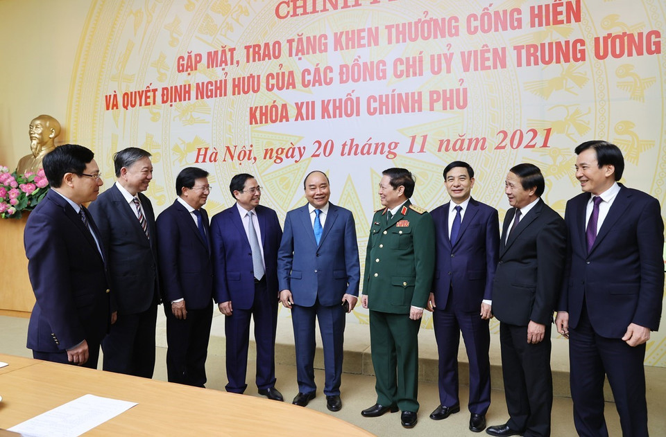 Chủ tịch nước Nguyễn Xuân Phúc và Thủ tướng Chính phủ Phạm Minh Chính với các đại biểu. (Ảnh: Dương Giang/TTXVN)