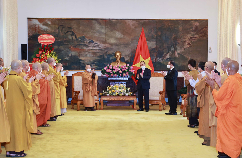 Chủ tịch nước Nguyễn Xuân Phúc với các đại biểu tại buổi tiếp. (Ảnh: Thống Nhất/TTXVN)