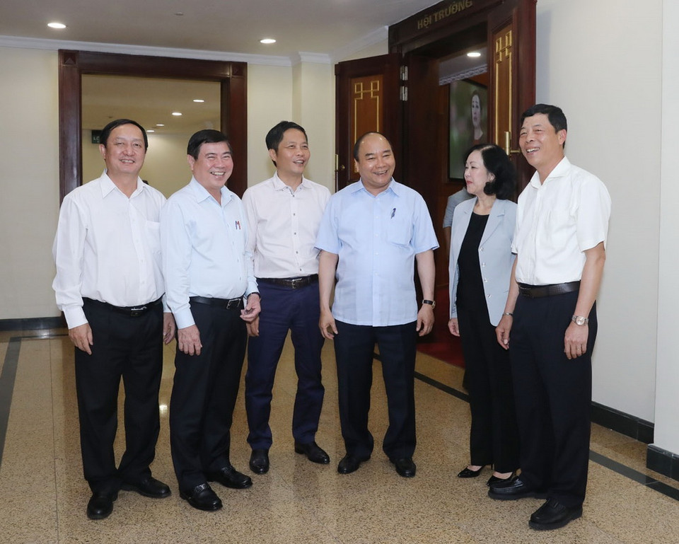 Ủy viên Bộ Chính trị, Thủ tướng Chính phủ Nguyễn Xuân Phúc với các đại biểu. (Ảnh: Phương Hoa/TTXVN)