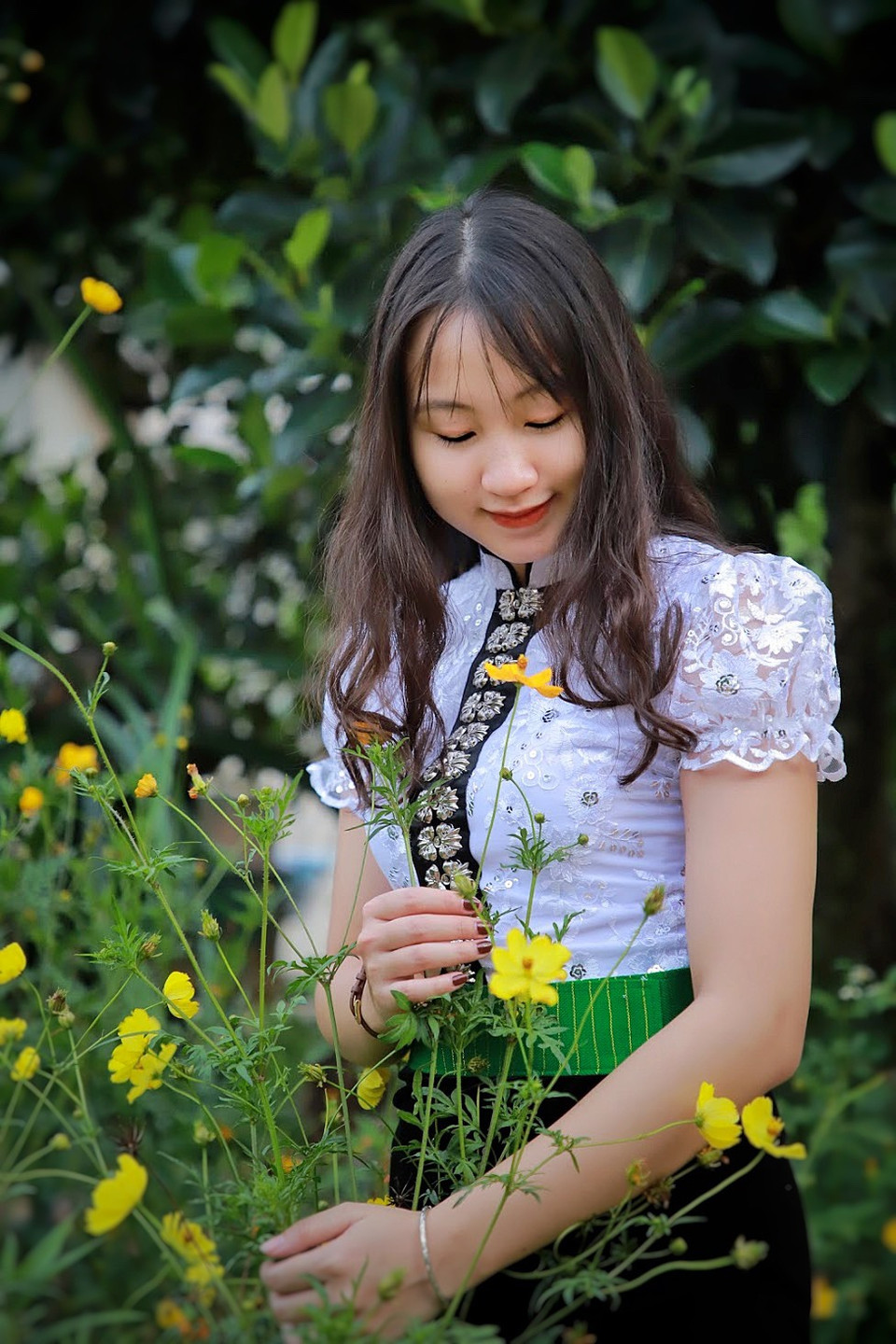 Những em gái Thái Sơn La vốn đã nức danh xinh đẹp và đảm đang. (Ảnh: Mai Mai/Vietnam+)