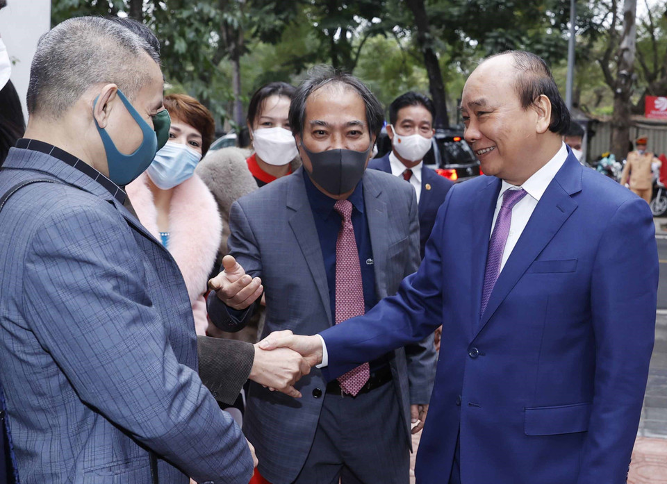 Chủ tịch nước Nguyễn Xuân Phúc tới dự Lễ phát động sáng tác văn học về đề tài thiếu nhi. (Ảnh: Thống Nhất/TTXVN)