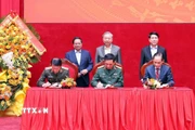 Tổng Bí thư Tô Lâm, Chủ tịch nước Lương Cường và Thủ tướng Phạm Minh Chính chứng kiến Lễ ký Quy chế phối hợp giữa Bộ Công an, Bộ Quốc phòng, Bộ Ngoại giao. (Ảnh: Phạm Kiên/TTXVN)