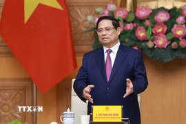 Thủ tướng Phạm Minh Chính tiếp đoàn lãnh đạo doanh nghiệp bán dẫn quốc tế. (Ảnh: Dương Giang/TTXVN)