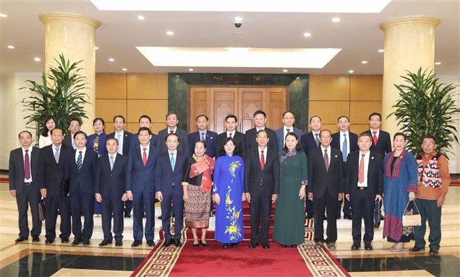 Đại biểu Ban Dân vận Trung ương và Ủy ban Trung ương Mặt trận Lào xây dựng đất nước tại hội đàm. (Ảnh: Phương Hoa/TTXVN) Việt Nam-Lào tăng cường chia sẻ kinh nghiệm về vận động quần chúng ảnh 2