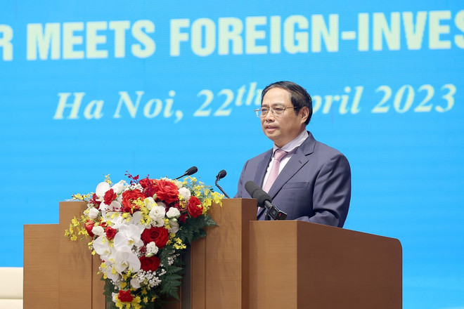 Thủ tướng Phạm Minh Chính phát biểu khai mạc hội nghị. (Ảnh: Dương Giang/TTXVN) Doanh nghiệp FDI là một bộ phận cấu thành quan trọng của kinh tế VN ảnh 1