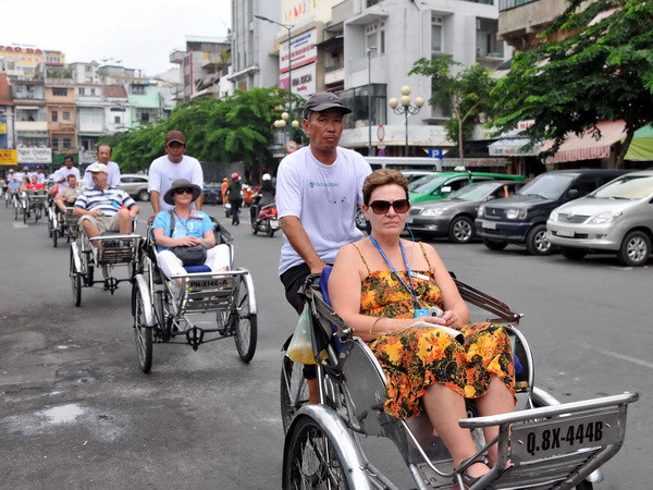 Khách du lịch quốc tế đến Việt Nam ước đạt gần 4,9 triệu lượt ảnh 1