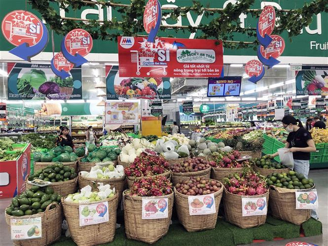 Một siêu thị thiết kế khu vực riêng để tiếp thị đa dạng nông sản, thực phẩm Việt đến người tiêu dùng. (Ảnh: Mỹ Phương/TTXVN) Bùng nổ Tuần hàng nông sản, thực phẩm tại các siêu thị ở TP.HCM ảnh 1