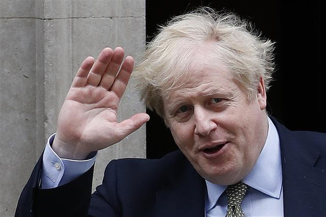 Thủ tướng Anh Boris Johnson tại Phố Downing ngày 18/3. (Ảnh: AFP/TTXVN) Thủ tướng Anh Boris Johnson trở lại làm việc từ ngày 27/4 ảnh 1