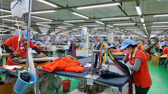 Ảnh minh họa. (Ảnh: TTXVN) Bốn nhóm giải pháp hỗ trợ doanh nghiệp bị tác động bởi dịch COVID-19 ảnh 1
