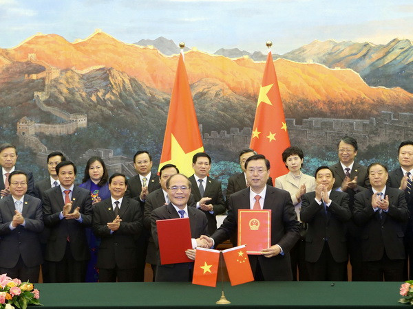 Ký kết Thỏa thuận hợp tác giữa Quốc hội Việt Nam và Trung Quốc ảnh 1