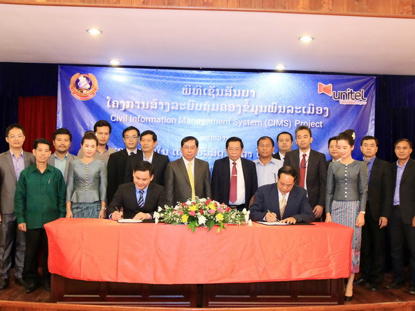 Quang cảnh lễ ký. (Ảnh: Phạm Kiên/Vietnam+) Viễn thông Lào-Việt hỗ trợ Lào xây dựng hệ thống quản lý dân số ảnh 1