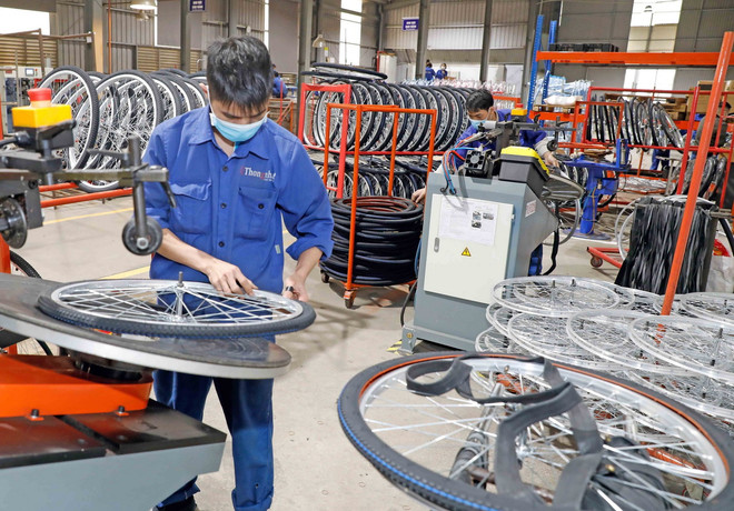 Công ty xe đạp Thống Nhất sản xuất xe đạp tiêu thụ thị trường trong nước và xuất khẩu. (Ảnh: Trần Việt/TTXVN) ttxvn_san xuat xe dap.jpg