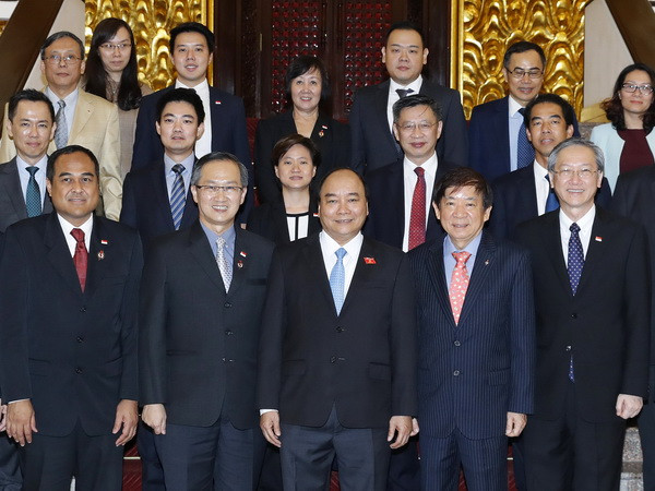 Thủ tướng Nguyễn Xuân Phúc tiếp ông Khaw Boon Wan, Chủ tịch Đảng Hành động Nhân dân Singapore (PAP), Bộ trưởng Điều phối Cơ sở hạ tầng, Bộ trưởng Giao thông Singapore. (Ảnh: Thống Nhất/TTXVN) Thủ tướng tiếp đoàn Đảng Hành động Nhân dân Singapore cầm quyền ảnh 1