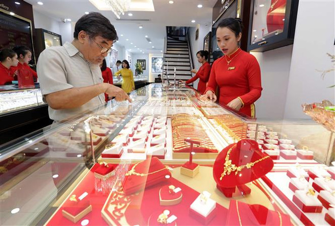 Các nhân tố rủi ro giảm xuống, nhu cầu với vàng bị hạn chế ảnh 1