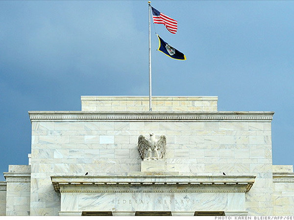 Fed tiếp tục cắt giảm gói cứu trợ nhưng chưa tăng lãi suất cơ bản ảnh 1