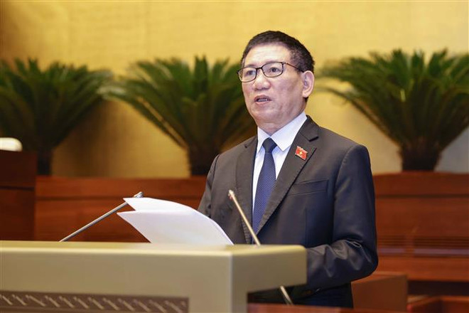 Bộ trưởng Bộ Tài chính Hồ Đức Phớc, thừa ủy quyền của Thủ tướng Chính phủ trình bày Tờ trình dự thảo Nghị quyết về việc áp dụng Thuế Thu nhập Doanh nghiệp Bổ sung theo quy định chống xói mòn cơ sở thuế toàn cầu. (Ảnh: Doãn Tấn/TTXVN) Nội dung ngày làm việc cuối của đợt 1 Kỳ họp thứ 6 Quốc hội khóa XV ảnh 2
