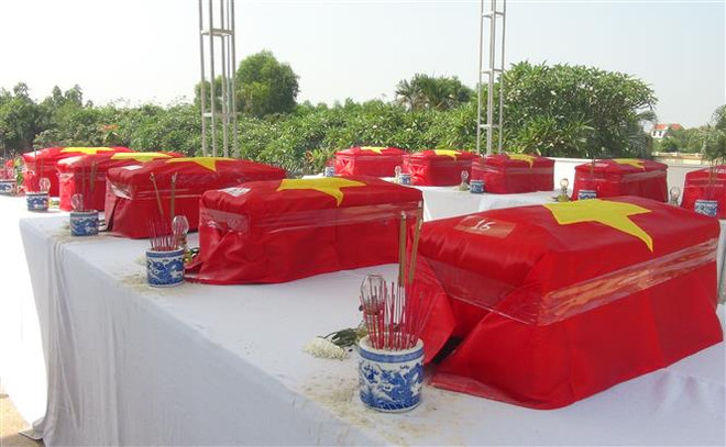 An táng hài cốt liệt sỹ quân tình nguyện và chuyên gia hy sinh tại Lào ảnh 1