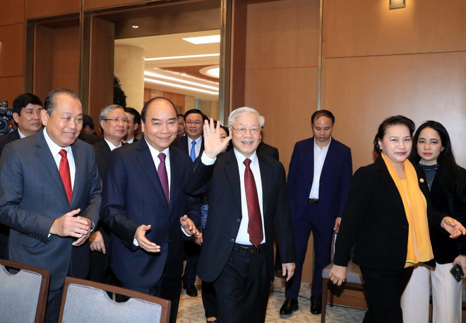 Tổng Bí thư, Chủ tịch nước Nguyễn Phú Trọng, Thủ tướng Nguyễn Xuân Phúc, Chủ tịch Quốc hội Nguyễn Thị Kim Ngân đến dự hội nghị. (Ảnh: Thống Nhất/TTXVN) "Năm 2020 lại phải đạt nhiều thành tích và tiến bộ hơn năm 2019” ảnh 2
