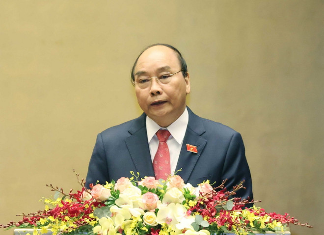 Thủ tướng Nguyễn Xuân Phúc trình bày báo cáo tổng kết của Chính phủ nhiệm kỳ 2016-2021. (Ảnh: Thống Nhất/TTXVN) Cử tri đánh giá cao các báo cáo nhiệm kỳ với tinh thần thẳng thắn ảnh 2