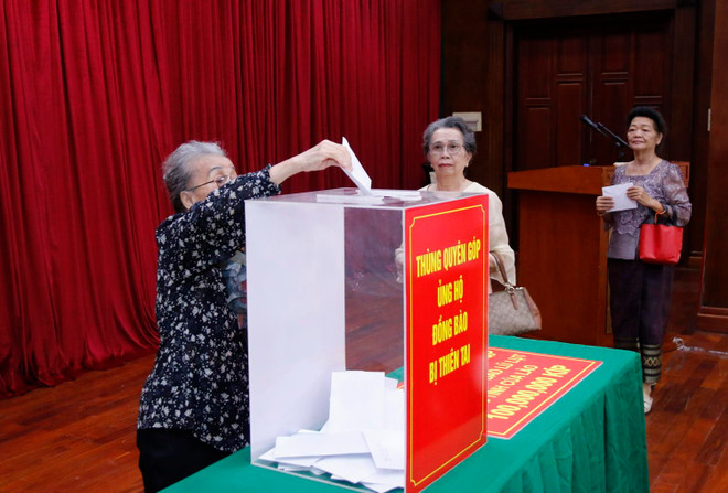 Người Việt ở Lào giúp người dân địa phương khắc phục thiên tai ảnh 3