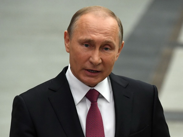 Tổng thống Nga Vladimir Putin. (Ảnh: AFP/TTXVN) TASS: Ukraine phản đối chuyến thăm Crimea của Tổng thống Nga Putin ảnh 1