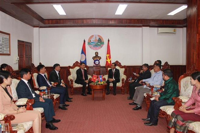 Tổng Lãnh sự quán Việt Nam tại Pakse chúc mừng 47 năm Quốc khánh Lào ảnh 3