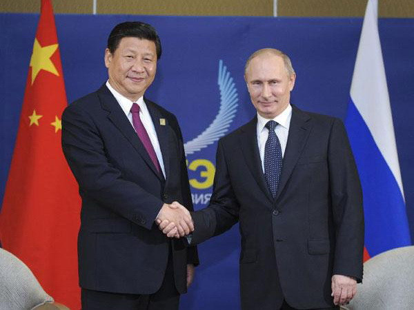 Tổng thống Nga Vladimir Putin và Chủ tịch Trung Quốc Tập Cận Bình tại Bali năm 2013. (Nguồn: Xinhua Tổng thống Nga, Chủ tịch Trung Quốc sẽ dự khai mạc tập trận ảnh 1