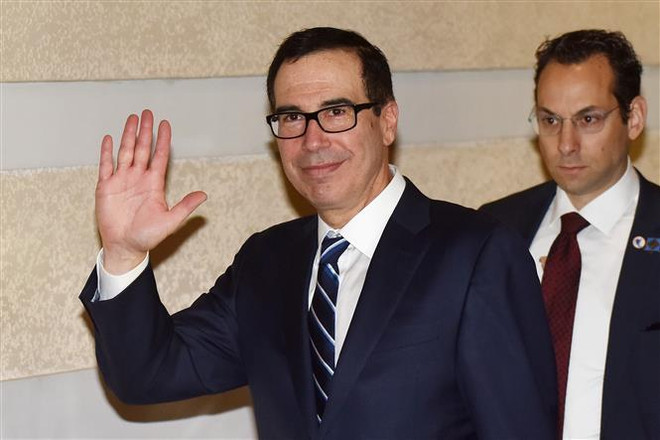 Bộ trưởng Tài chính Mỹ Steven Mnuchin (trái) tại Bắc Kinh, Trung Quốc ngày 13/2. (Nguồn: AFP/TTXVN) Bộ trưởng Tài chính Mỹ để ngỏ khă năng sớm tới Trung Quốc ảnh 1