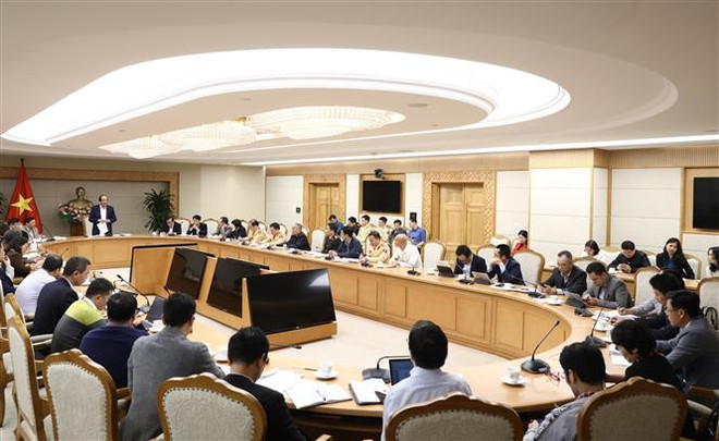 Toàn cảnh buổi làm việc. (Ảnh: Văn Điệp/TTXVN) Tích hợp 3 dịch vụ công trực tuyến lên Cổng Dịch vụ công quốc gia ảnh 2