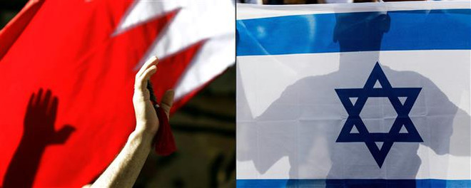 Cờ Bahrain (trái) và cờ Israel (phải). (Ảnh: AFP/TTXVN) Israel-Bahrain ký tuyên bố chung thiết lập quan hệ ngoại giao ảnh 1
