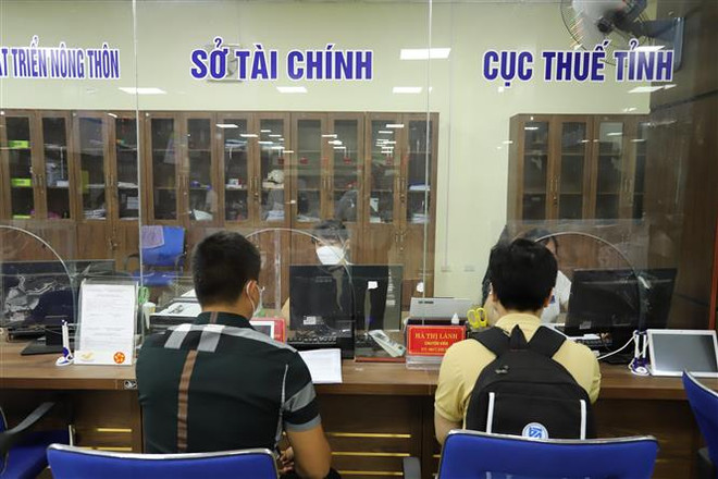 Một điểm thu ngân sách nhà nước tại tỉnh Yên Bái. (Ảnh: Tiến Khánh/TTXVN) Thu ngân sách nhà nước tăng 17,4% so với cùng kỳ năm trước ảnh 1