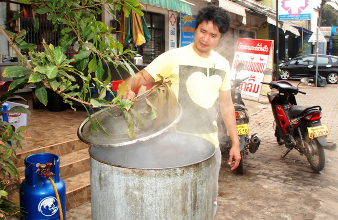 [Photo] Vientiane sôi động đón tết cổ truyền của người Việt ảnh 9