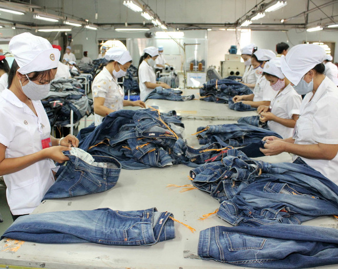 Dệt may là một trong những mặt hàng xuất khẩu của Việt Nam sang Đức. (Ảnh minh họa: Quách Lắm/TTXVN) Việt-Đức chia sẻ kinh nghiệm về Hiệp định thương mại tự do ảnh 1