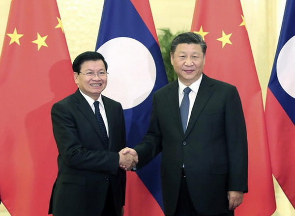 Lãnh đạo Trung Quốc-Lào điện đàm thúc đẩy quan hệ song phương ảnh 1