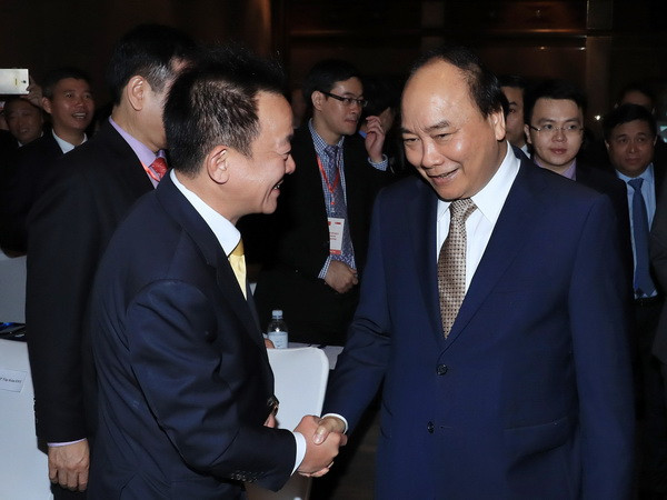 Thủ tướng Nguyễn Xuân Phúc và các đại biểu tham dự diễn đàn. (Ảnh: Thống Nhất/TTXVN) Thủ tướng Nguyễn Xuân Phúc dự Diễn đàn Kinh doanh Việt Nam-Singapore ảnh 2
