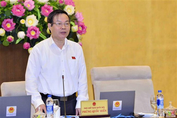 Phó Chủ tịch Quốc hội Phùng Quốc Hiển phát biểu tại phiên họp. (Ảnh: Phương Hoa/TTXVN) Thí điểm hợp nhất ba Văn phòng tại 10 tỉnh và thành phố ảnh 2