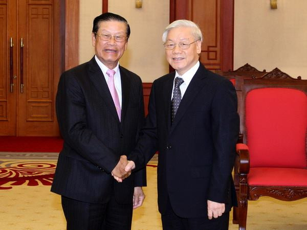 Lãnh đạo Đảng và Nhà nước tiếp Đoàn đại biểu cấp cao Lào ảnh 1