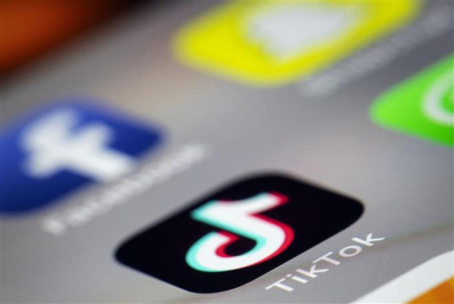 Logo của ứng dụng chia sẻ video Tik Tok. (Ảnh: AFP/TTXVN) Thêm 2 bang của Mỹ cấm sử dụng TikTok trên các thiết bị của chính phủ ảnh 1