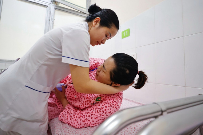 ttxvn_ba me tre em (2).jpeg