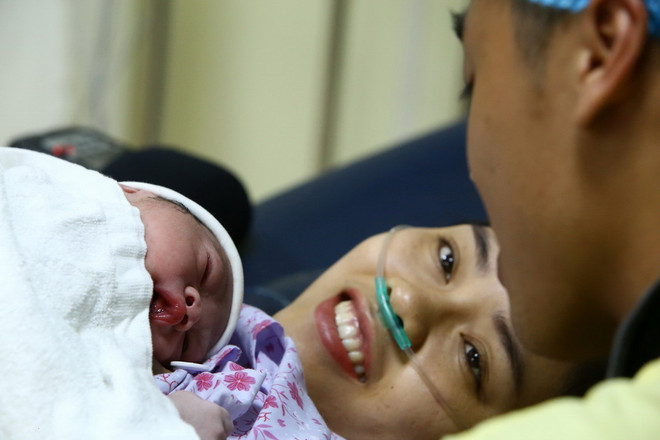 ttxvn_ba me tre em (1).jpg