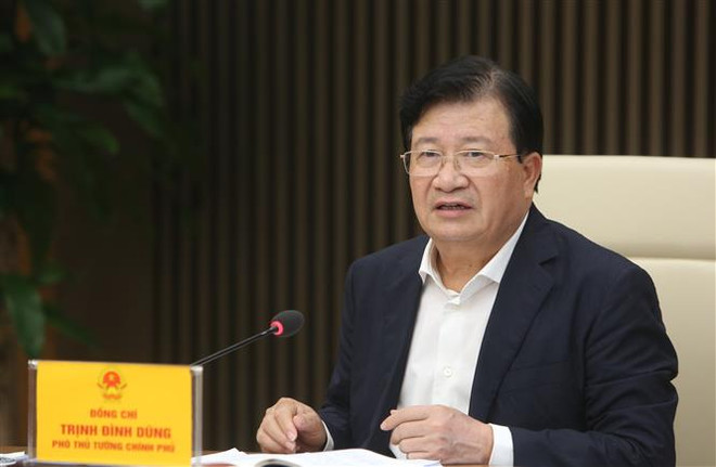 Phó Thủ tướng Trịnh Đình Dũng chủ trì cuộc họp. (Ảnh: Dương Giang/TTXVN) Tạm ứng trước hạn ngạch 100.000 tấn gạo xuất khẩu trong tháng 5 ảnh 1