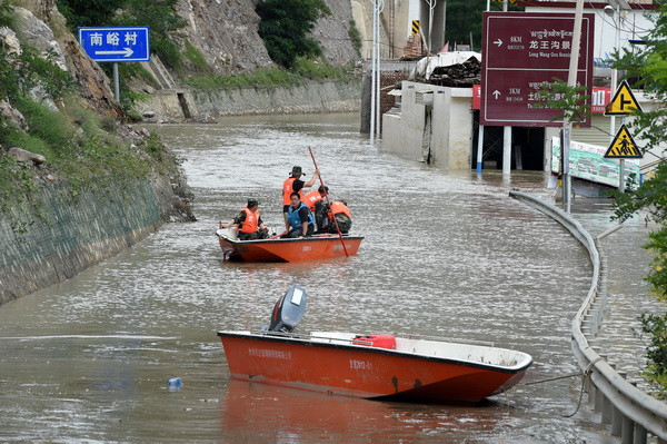 Trung Quốc: Hơn 50 người thương vong do mưa lớn và lũ quét ảnh 1