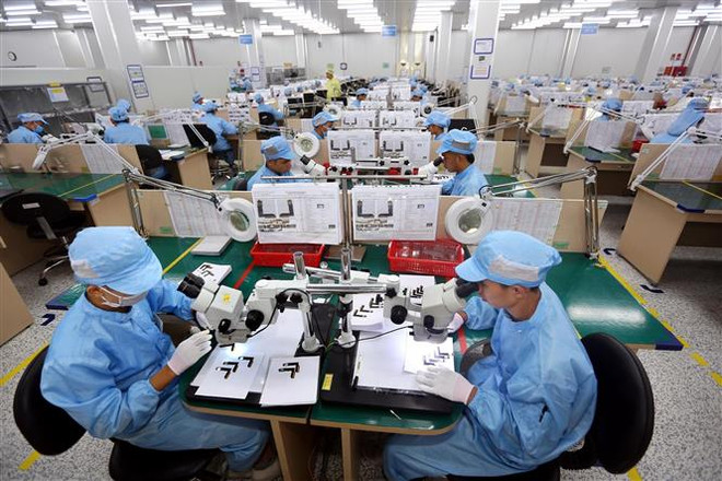 Việt Nam đang đẩy mạnh công nghiệp hóa, hiện đại hóa và hội nhập quốc tế. (Ảnh: Danh Lam/TTXVN) Phản ứng của VN về việc Hoa Kỳ đưa ra khỏi danh sách đang phát triển ảnh 1