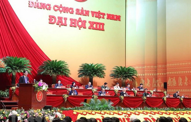 Đoàn Chủ tịch điều hành phiên họp, sáng 28/1. (Nguồn: TTXVN) Nhìn lại Đại hội XIII: Bài bản, chặt chẽ trong lựa chọn cán bộ ảnh 1