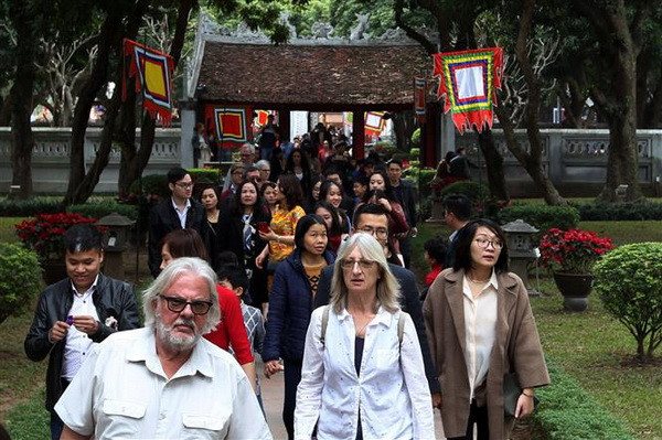 Khách quốc tế đến Việt Nam trong 11 tháng đã đạt hơn 14,1 triệu lượt ảnh 1