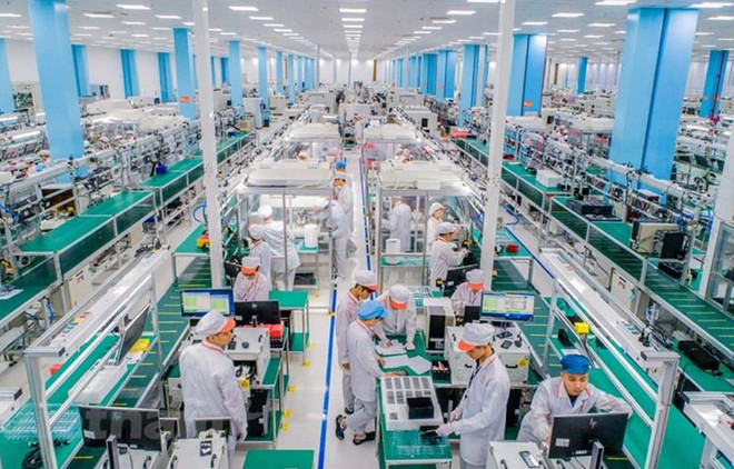 Dòng vốn FDI chảy mạnh vào Việt Nam. (Ảnh: PV/Vietnam+) HSBC: Việt Nam là điểm đến hấp dẫn với doanh nghiệp nước ngoài ảnh 2